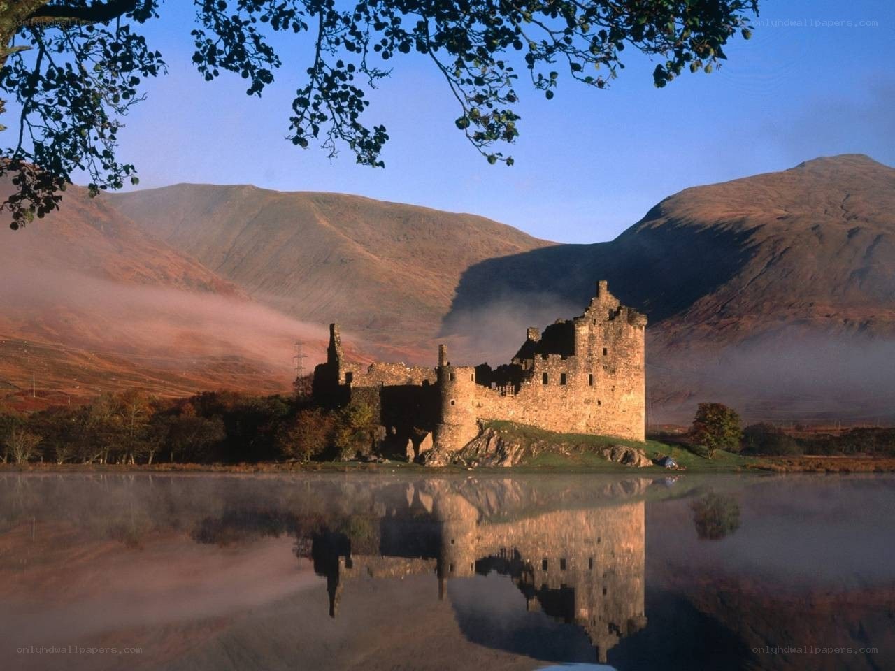 Castle by a misty lake