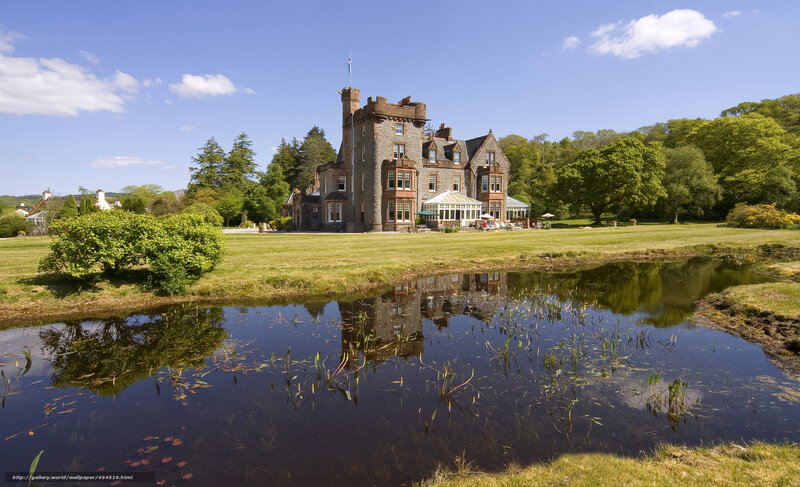 Castle by a pond on a sunny day