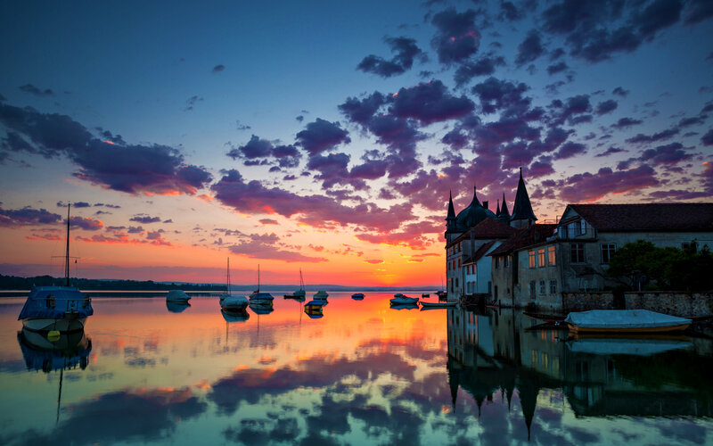 Castle by Lake at Sunset