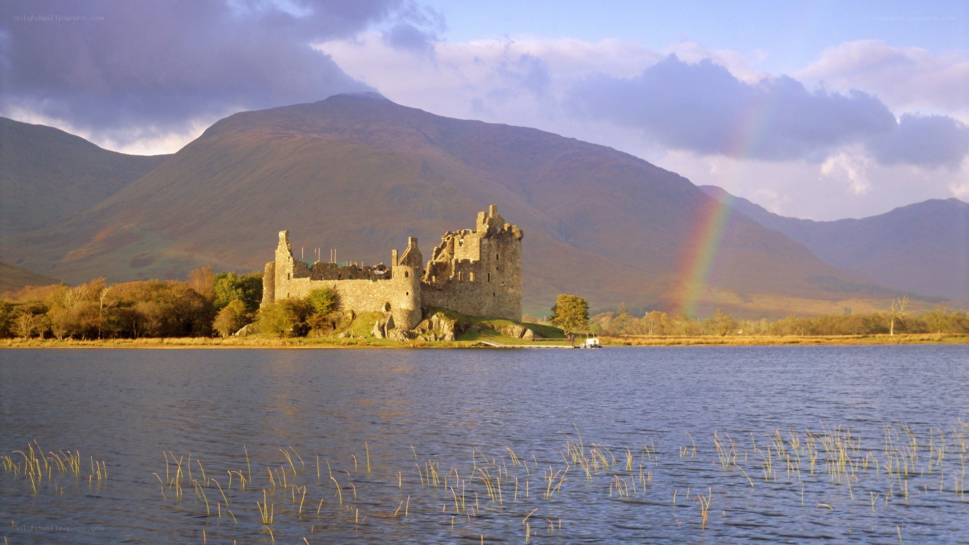 Castle by the lake with rainbow