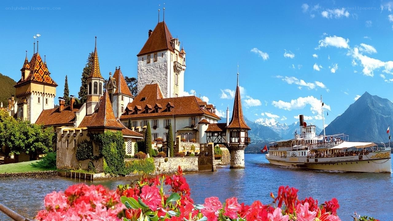 Castle by the lake with steamboat