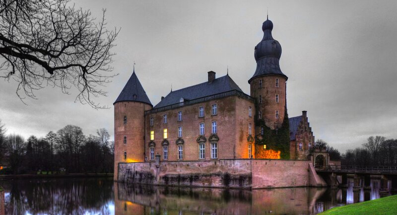 Castle by the moat at dusk