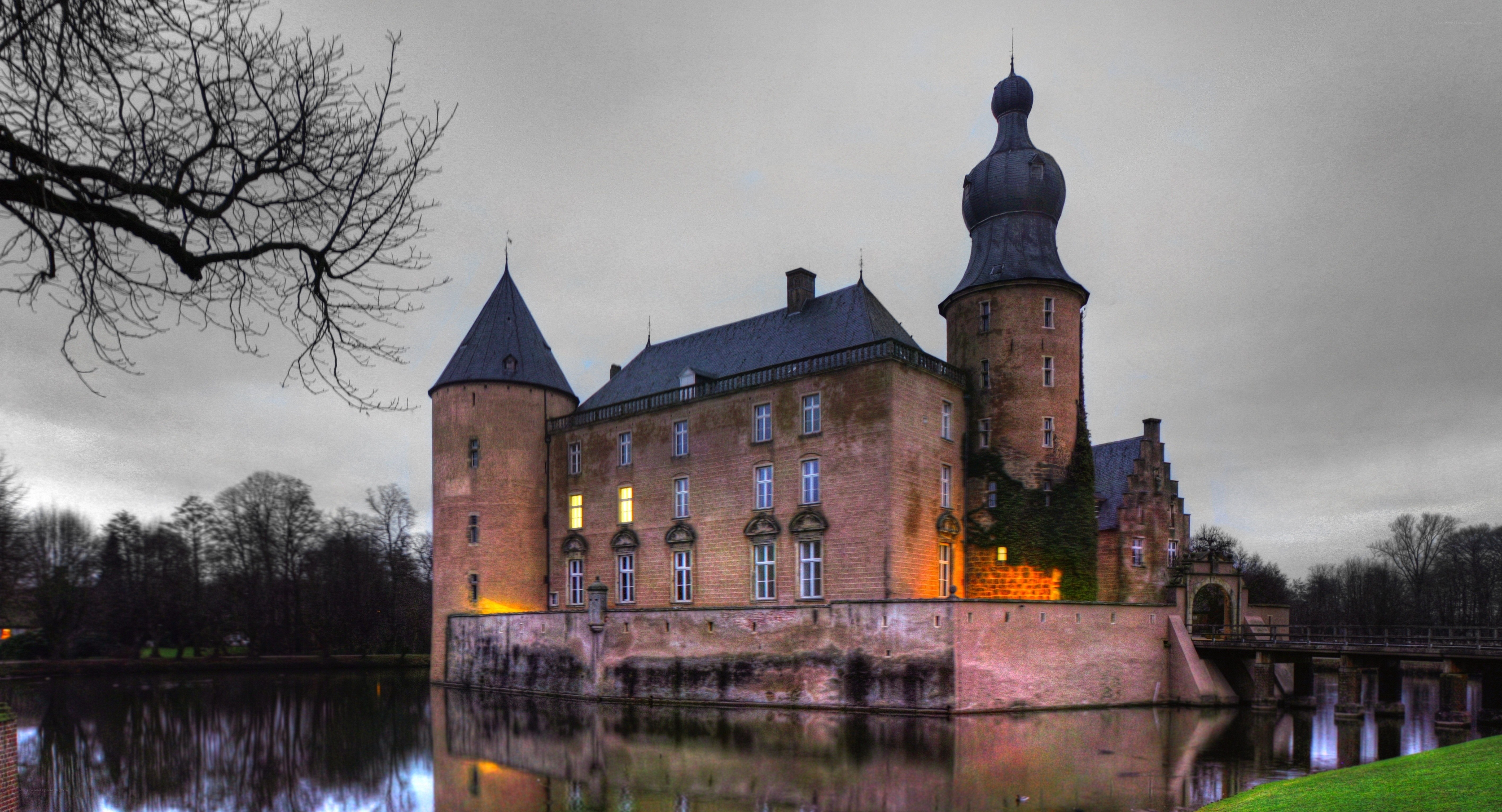 Castle by the moat at dusk