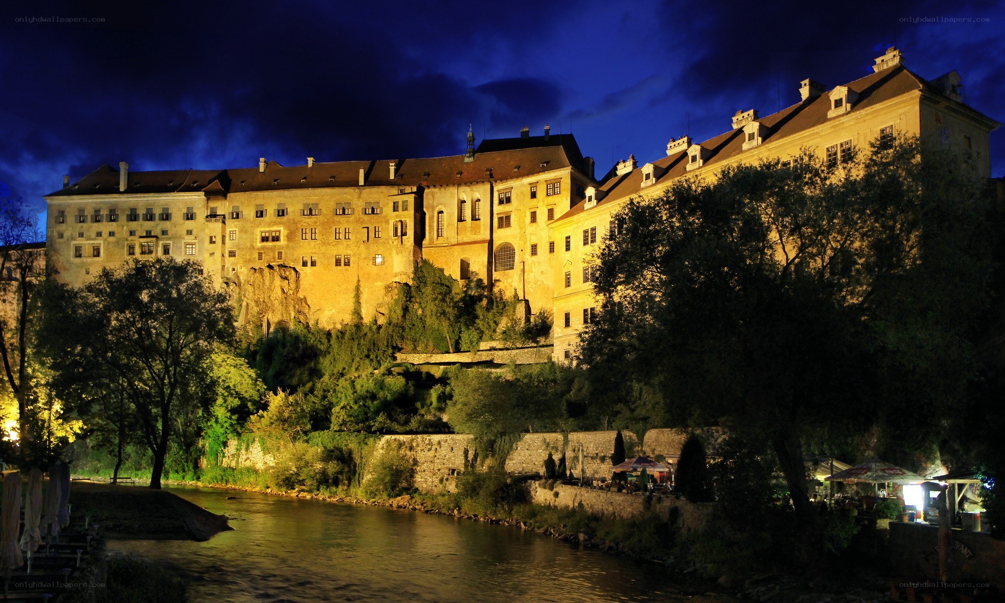 castle by the river at night