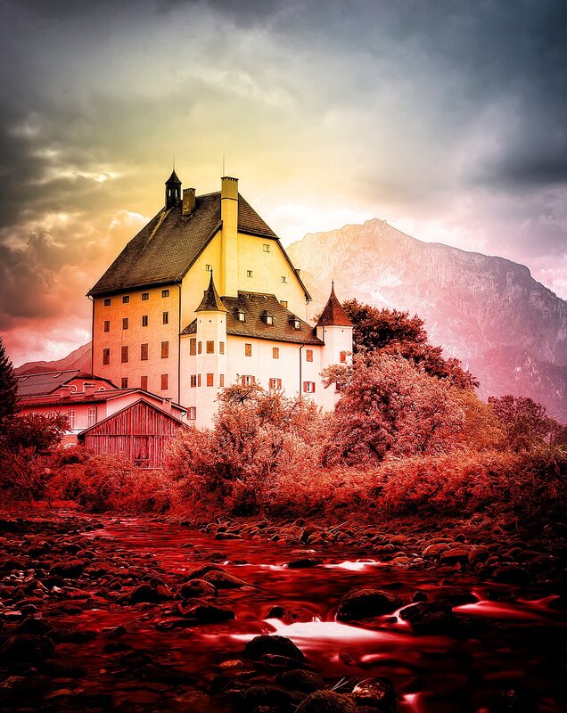 Castle by the river at sunset