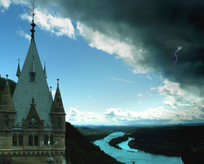 Castle by the river with storm