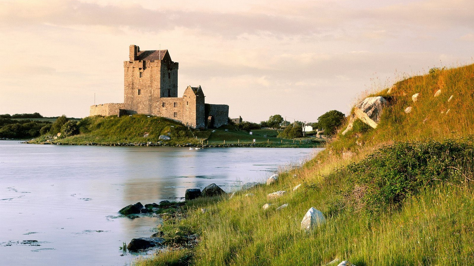 Castle by the water at sunset