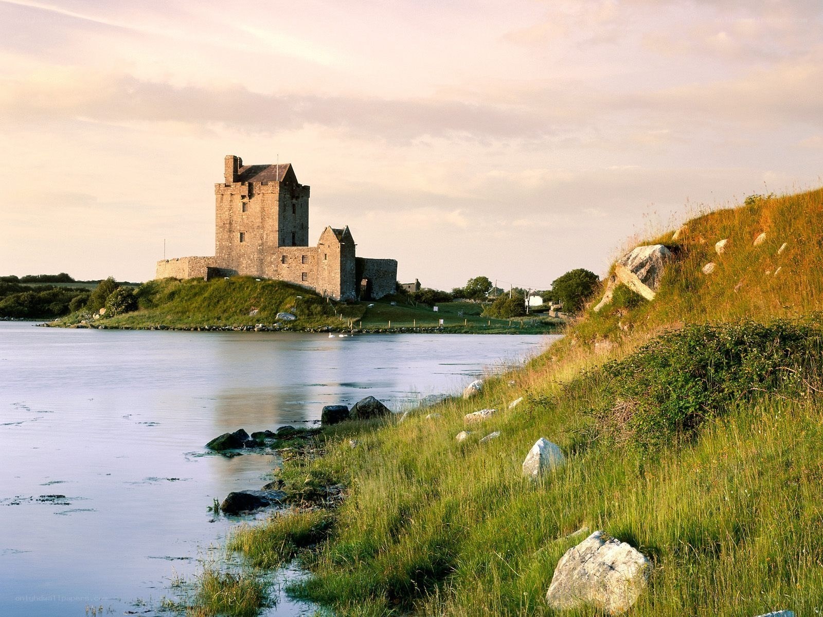 Castle by the water at sunset