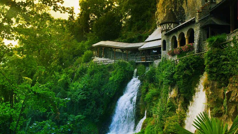 Castle by Waterfall — Green, Serene, Afternoon