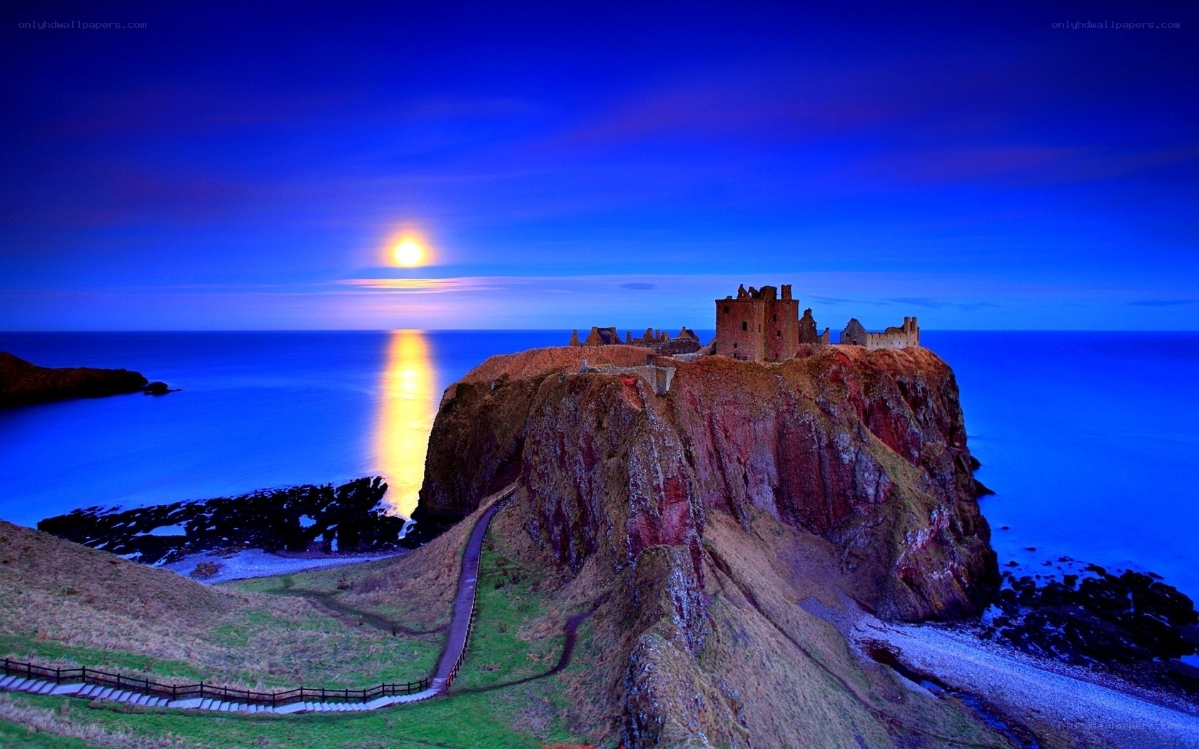Castle on a cliff at moonrise