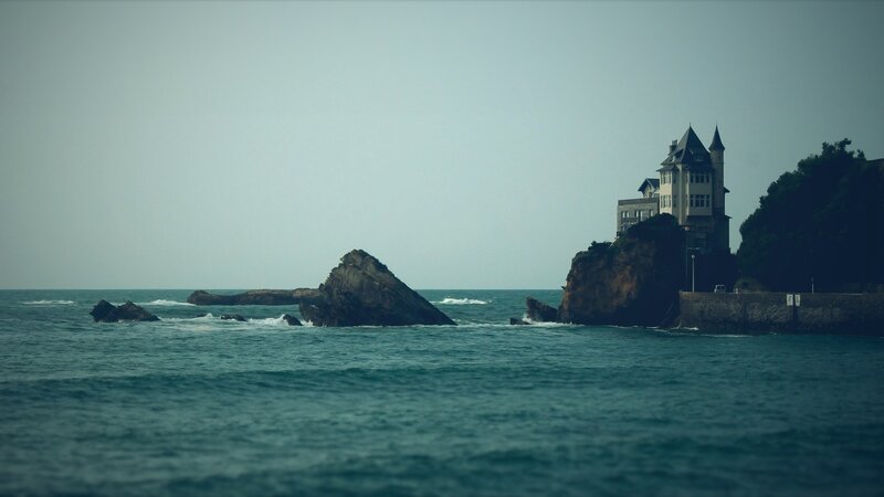 Castle on a Cliff — Blue, Serene, Afternoon, Photograph, Ocean, Rocks, Trees