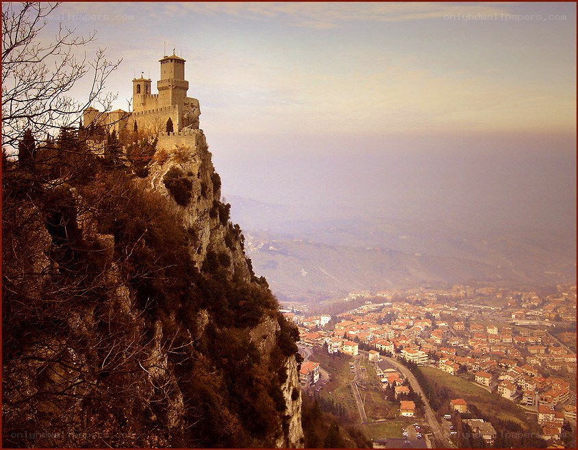 Castle on a cliff overlooking a town