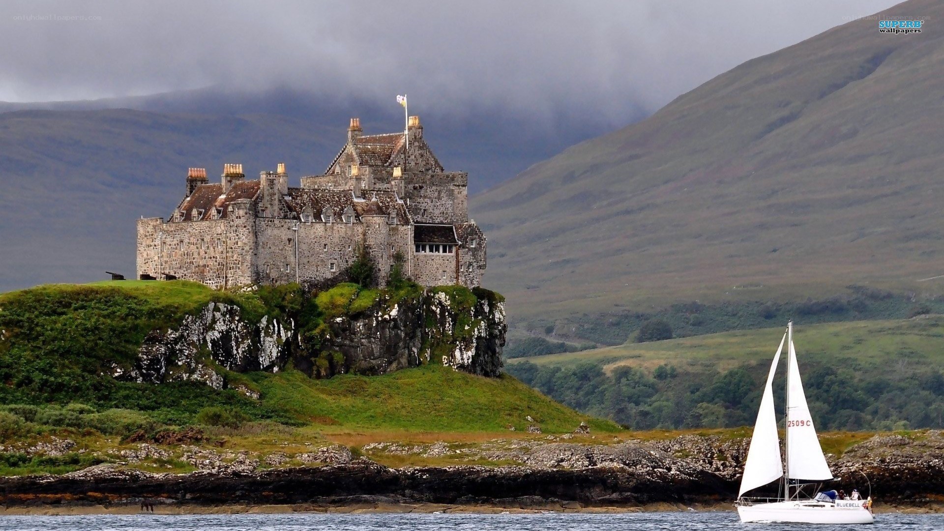Castle on a cliff with sailboat