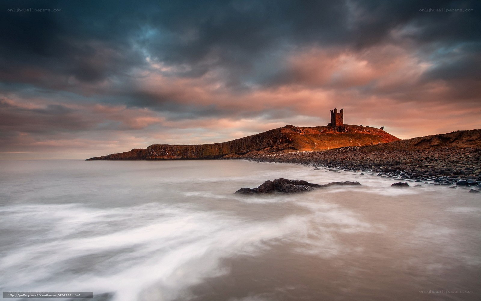 Castle on a coastal cliff at sunset