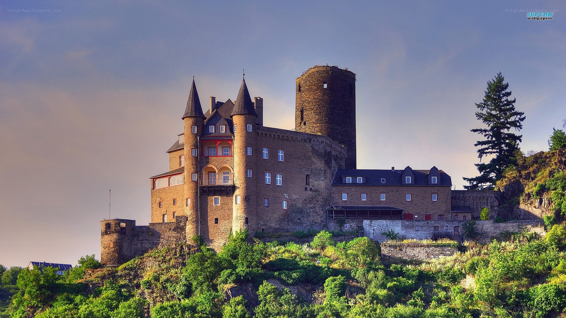 castle on a hill at sunset