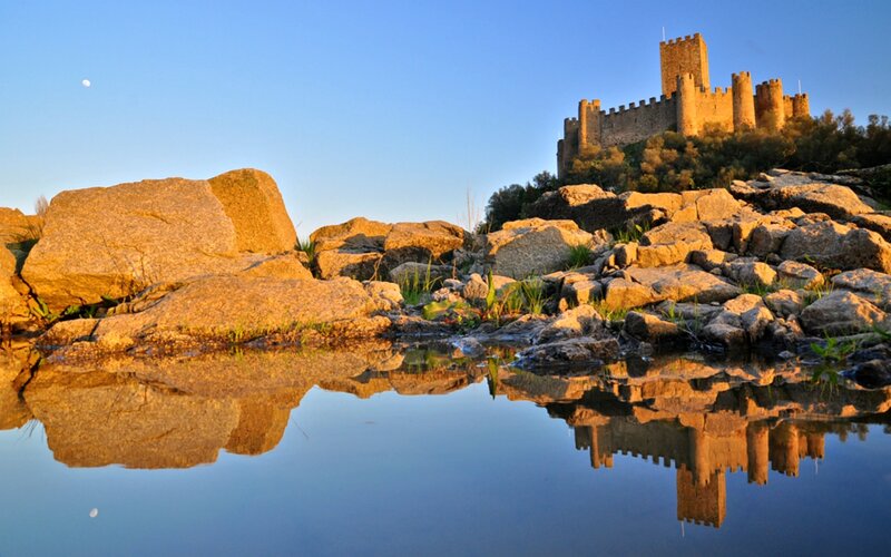 Castle on a Hill — Blue, Serene, Sunset, Photograph, Rocks