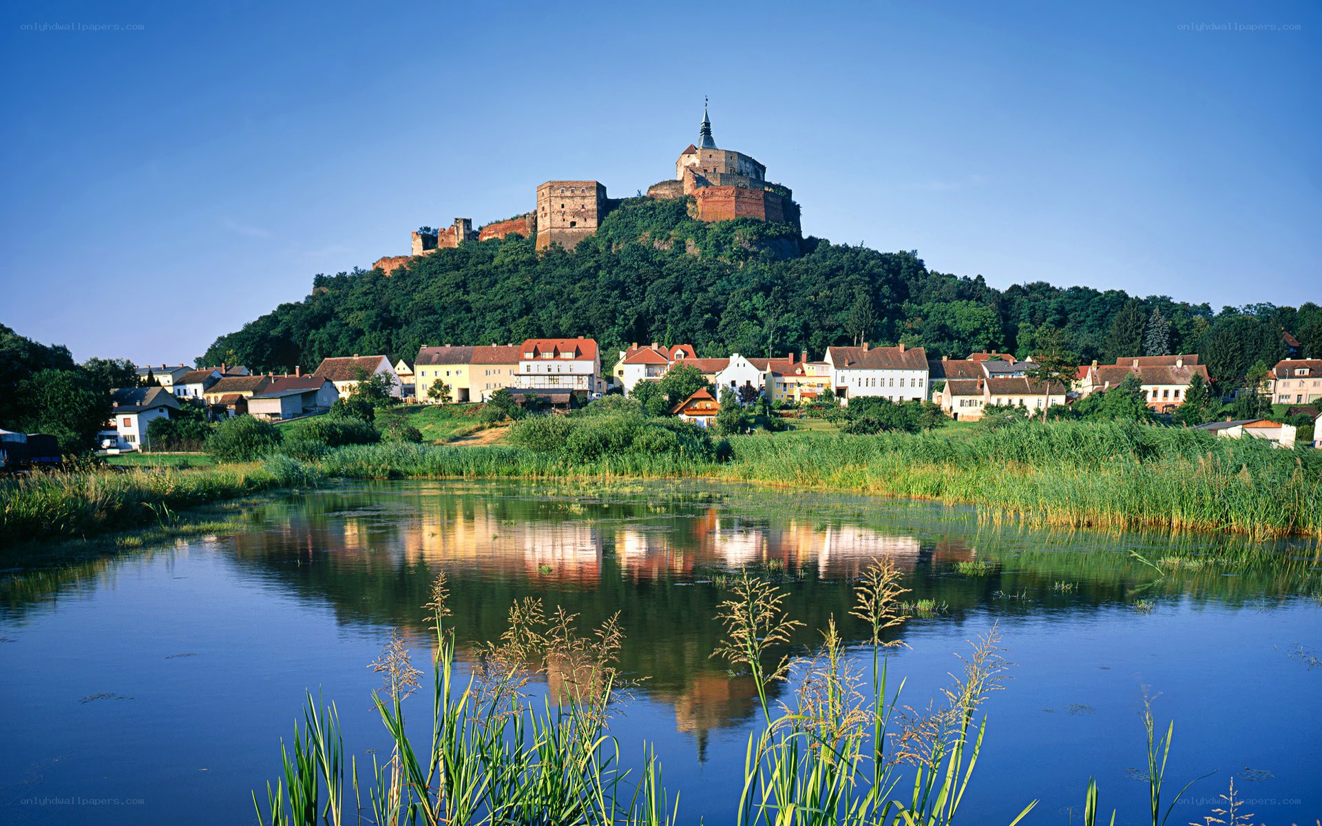 Castle on a hill by the river