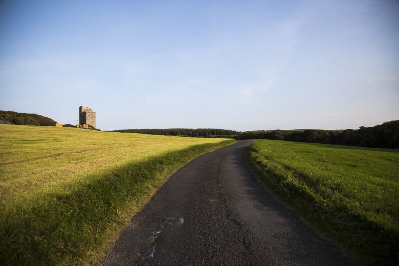 Castle on a Hill — Green, Serene, Afternoon, Photograph, Road, Field