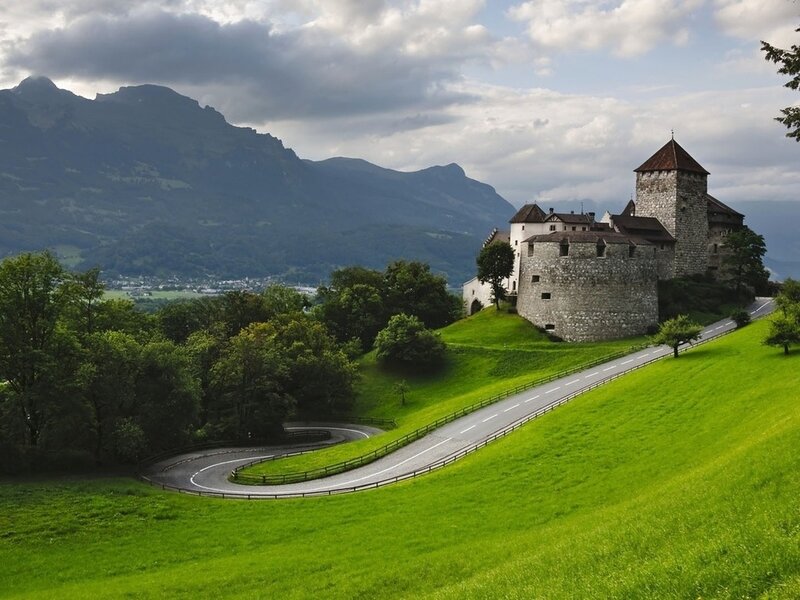 Castle on a Hill — Green, Serene, Afternoon, Photograph, Road, Mountains