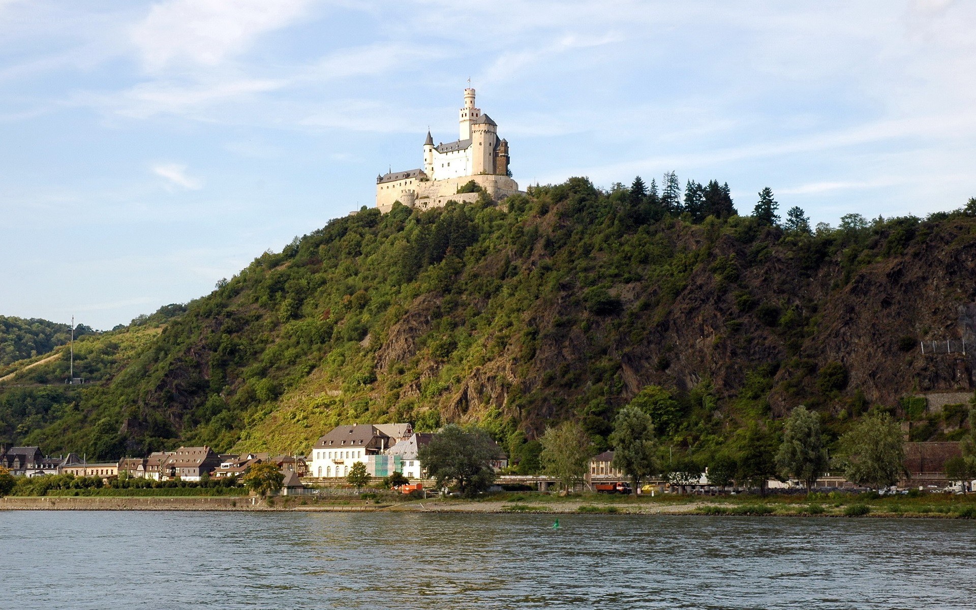 Castle on a hill overlooking a river