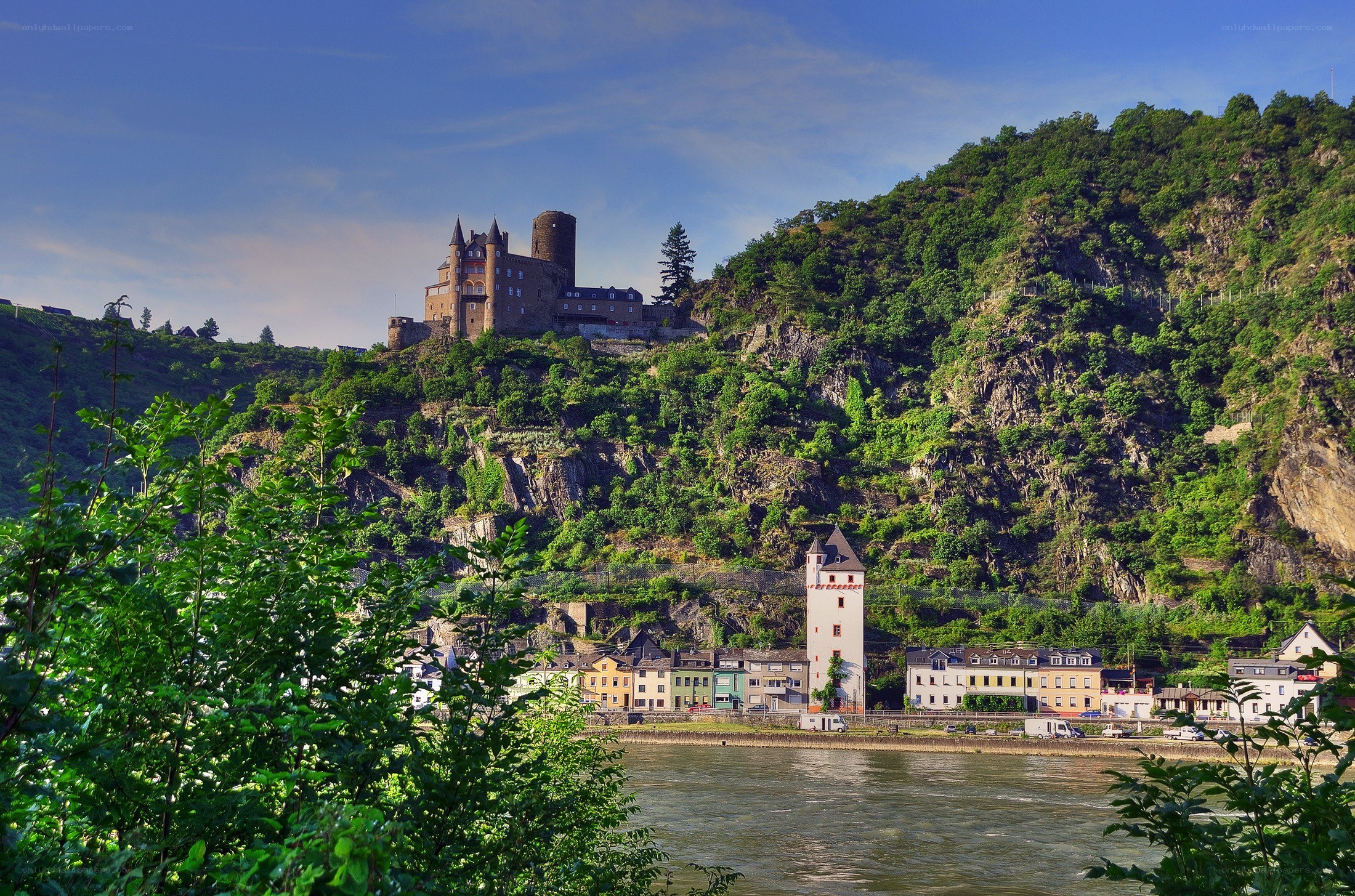Castle on a hill overlooking a river