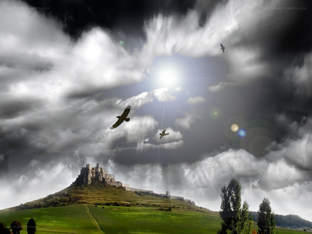 Castle on a hill under stormy sky