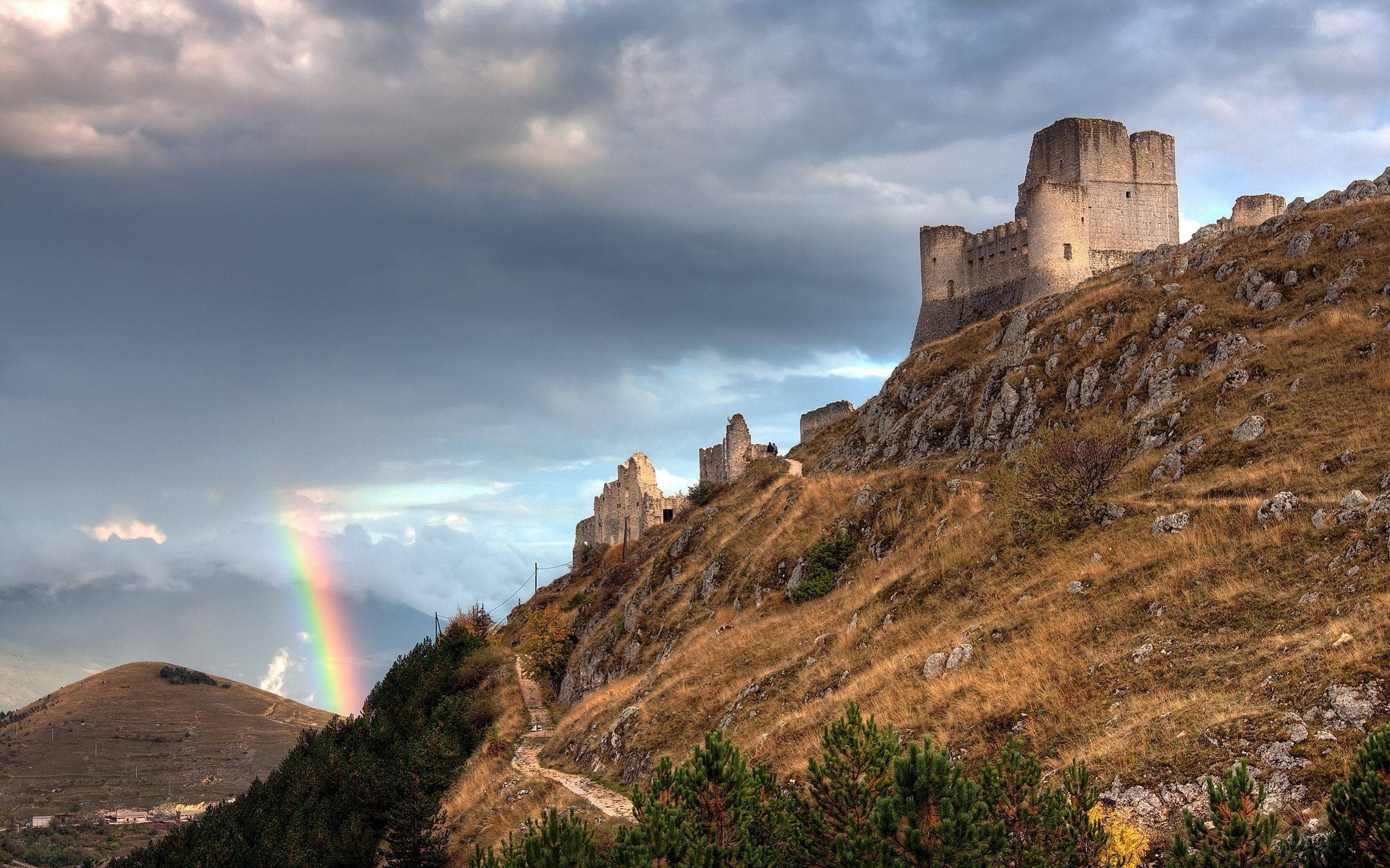Castle on a hill with rainbow