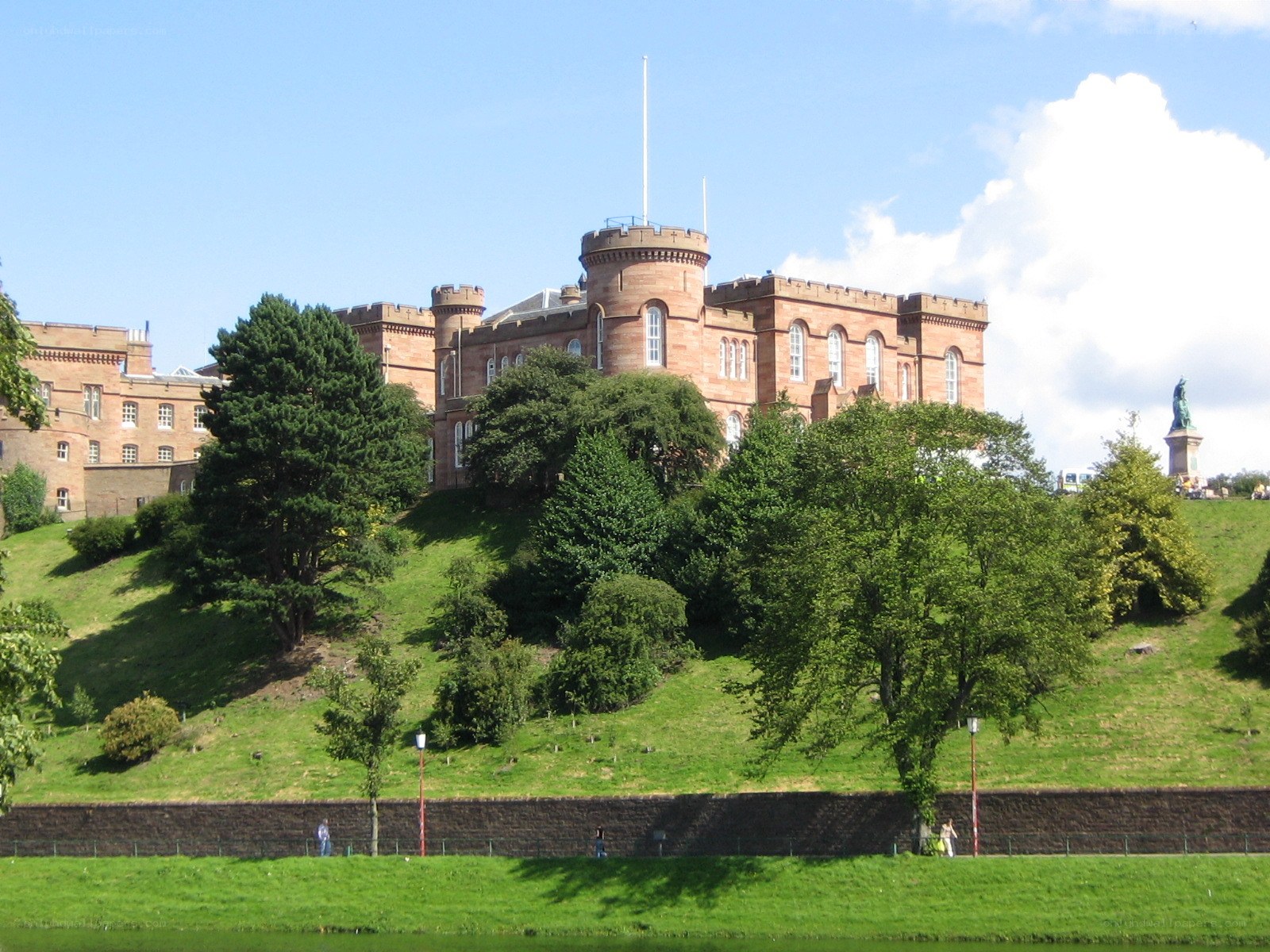 castle on a hill with trees