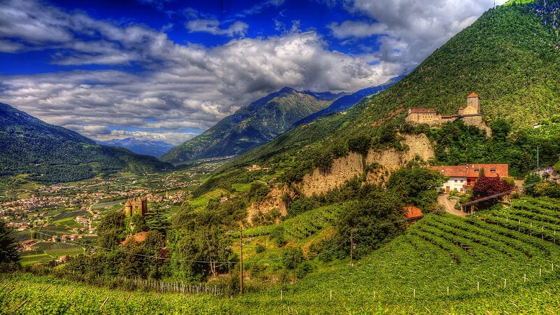 Castle on a Hillside — Green, Dramatic, Afternoon, Photograph, Mountains, Vineyards