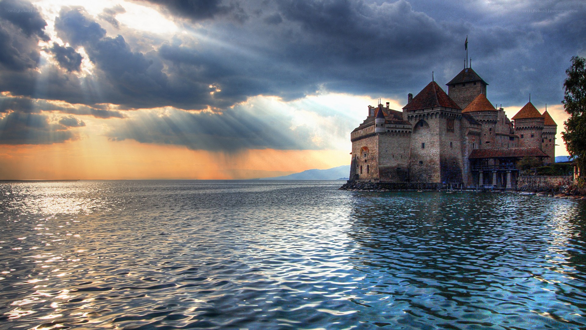 Castle on a lake at sunset