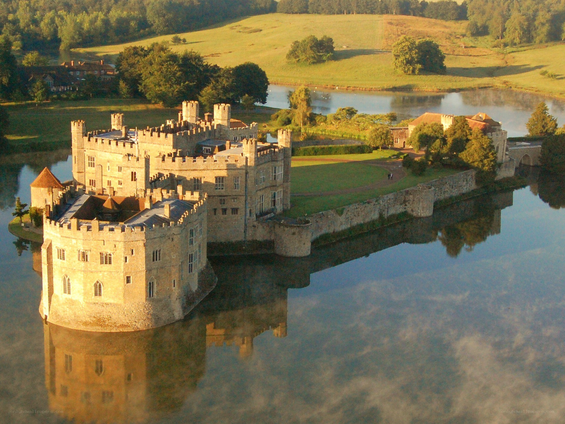 castle on a lake at sunset