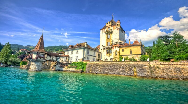 Castle on a Lake — Blue, Serene, Afternoon, Photograph, Bridge