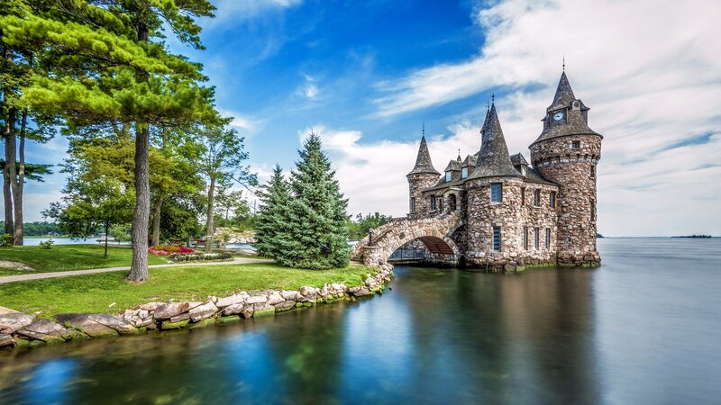 Castle on a Lake — Blue, Serene, Afternoon, Photograph, Trees, Bridge, Clock Tower