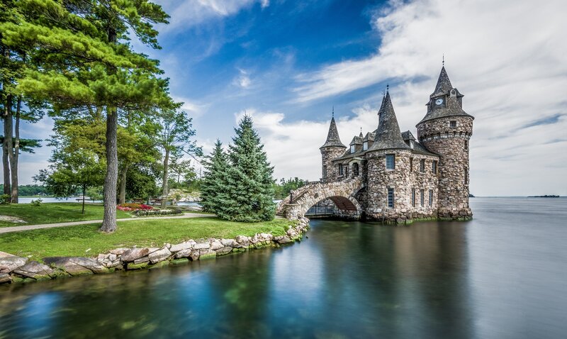 Castle on a Lake — Blue, Serene, Afternoon, Photograph, Trees, Bridge