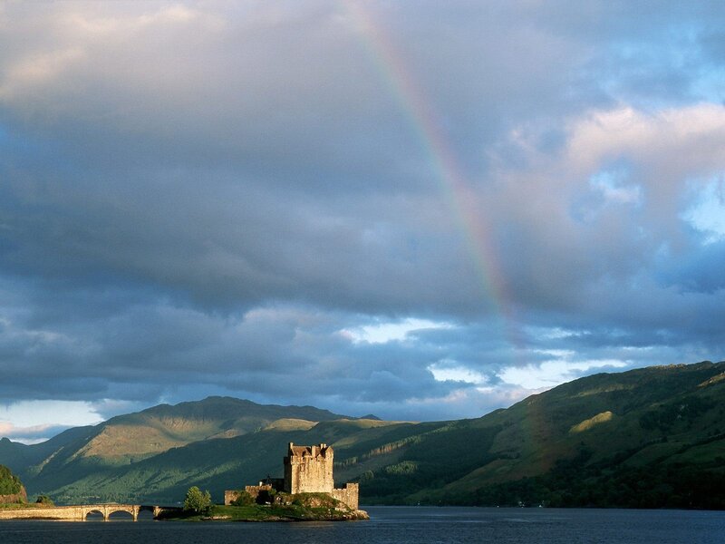 Castle on a lake with rainbow