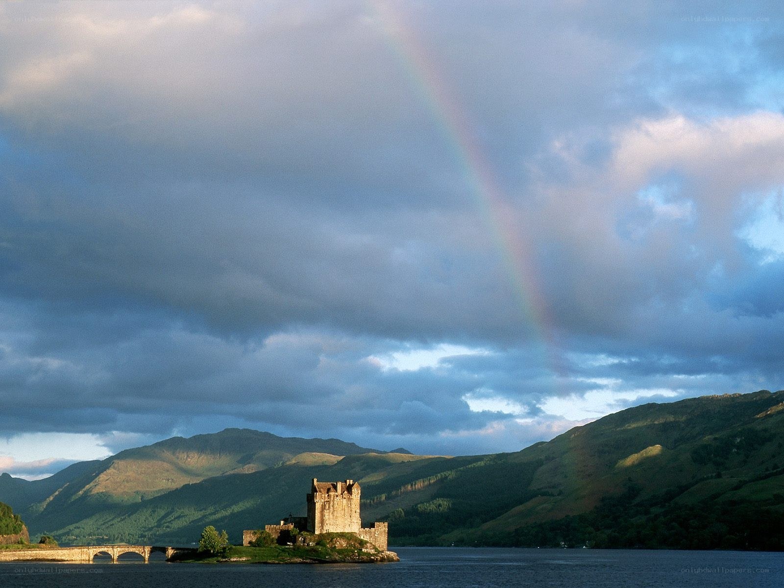 Castle on a lake with rainbow