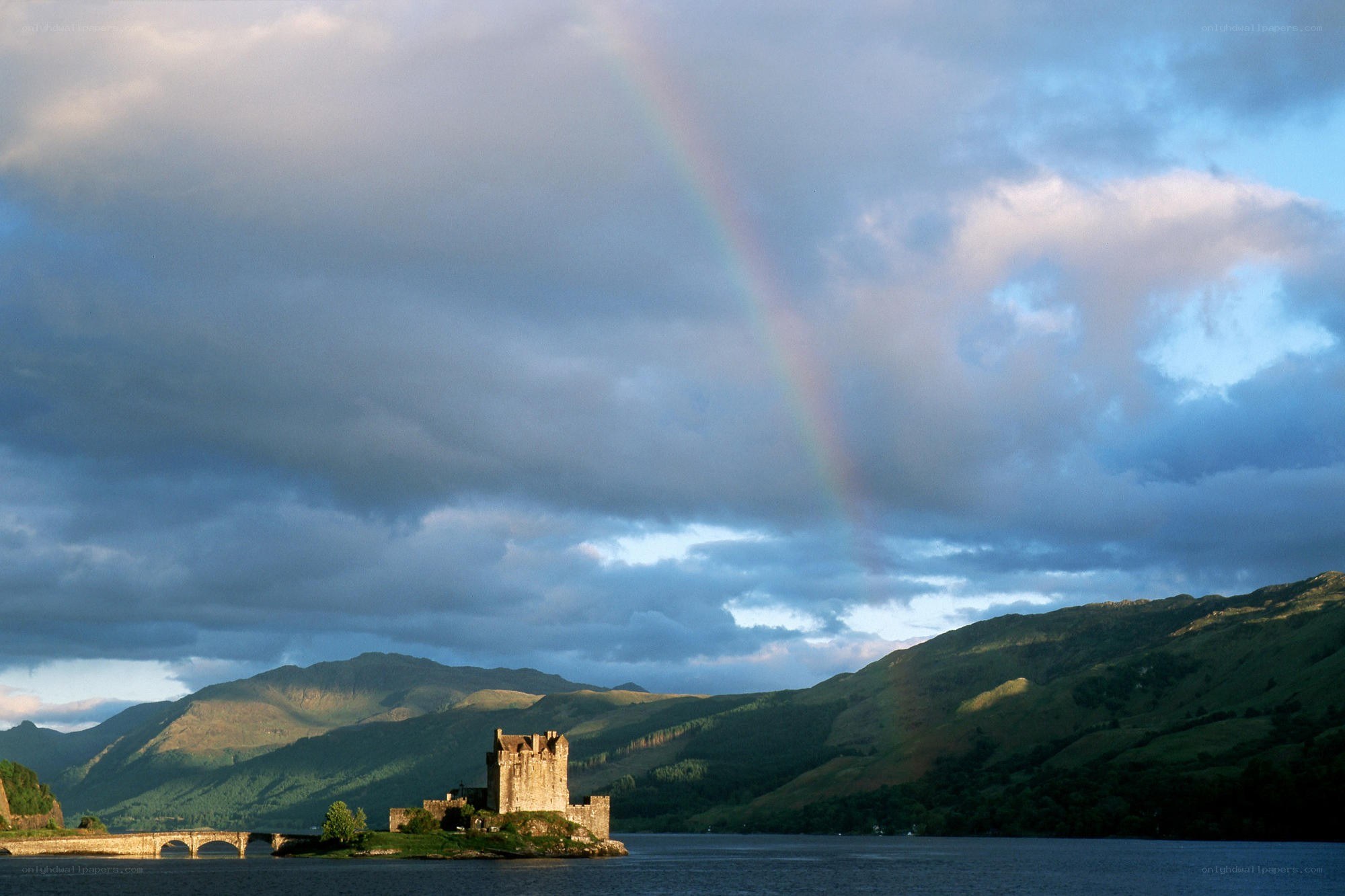 Castle on a lake with rainbow