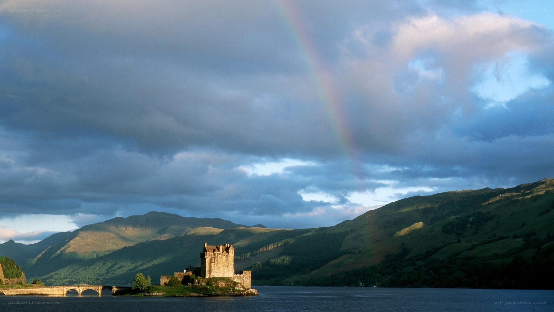 Castle on a lake with rainbow