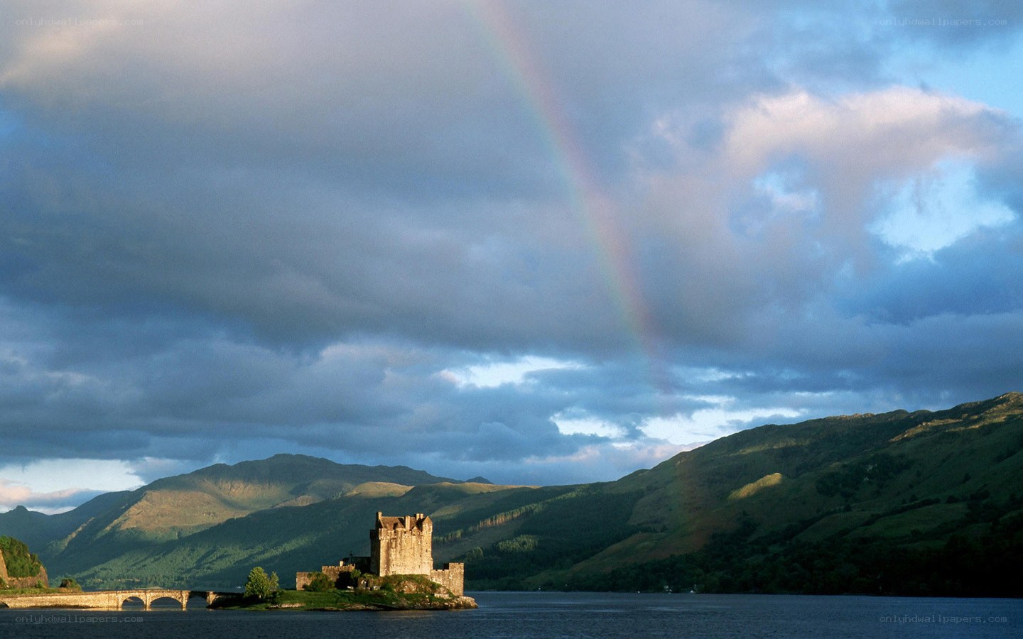 Castle on a lake with rainbow