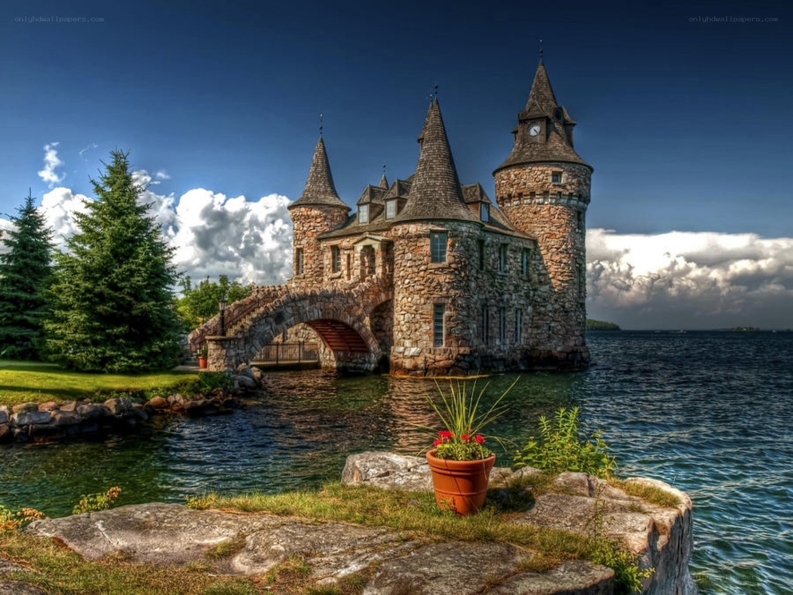 castle on a lake with stone bridge