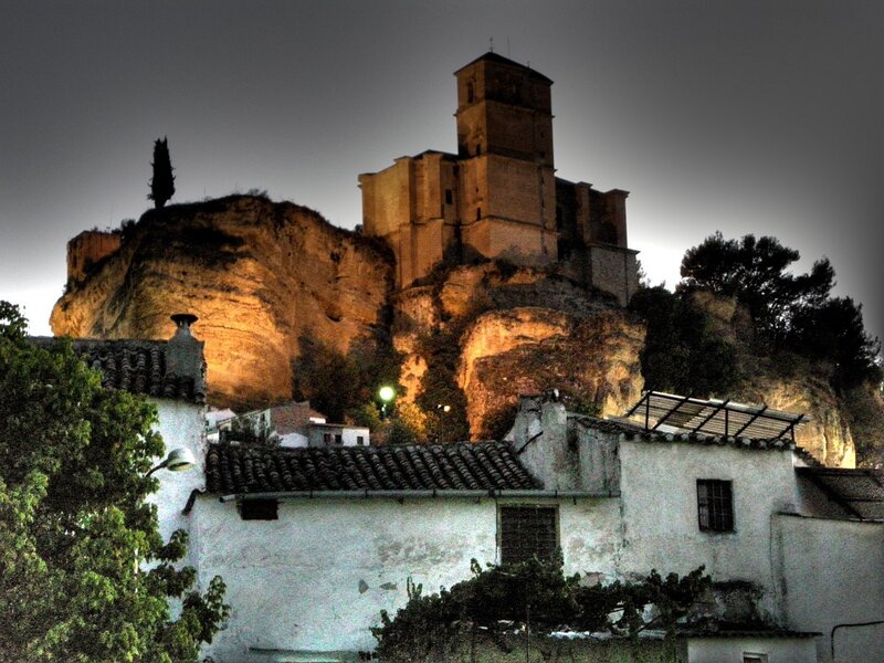 castle on a rocky hill at night