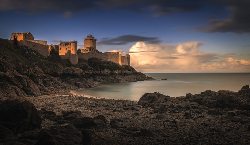 Castle on Rocky Coast — Blue, Dramatic, Sunset