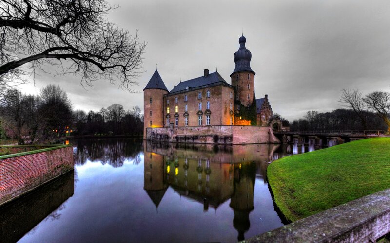 castle reflected in a moat