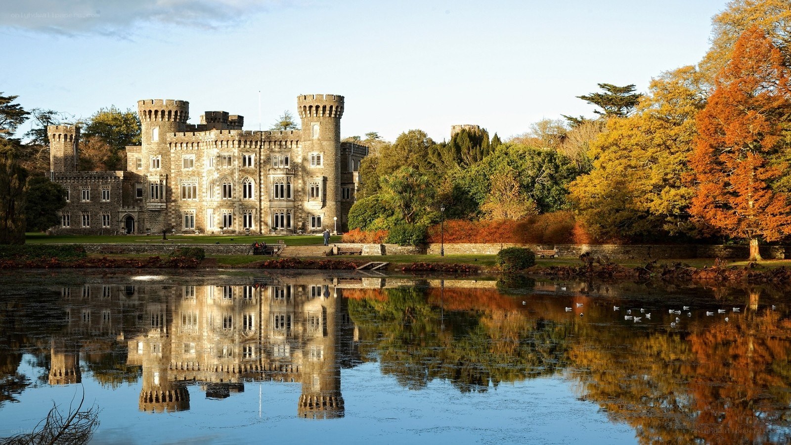 castle reflected in autumn pond