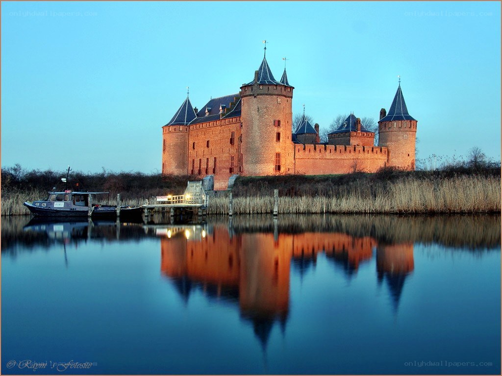 Castle reflected in calm water