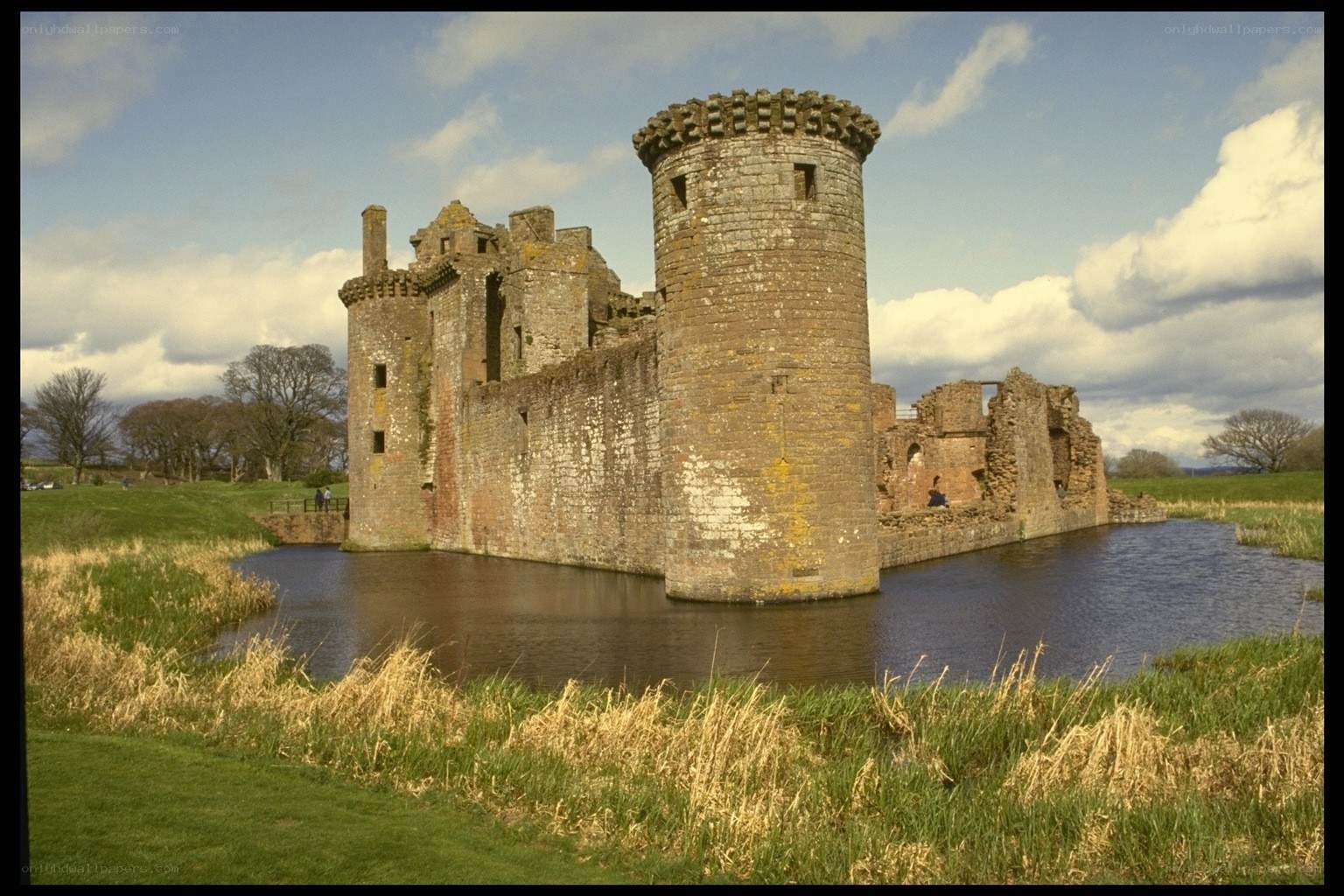 Castle ruins by a moat
