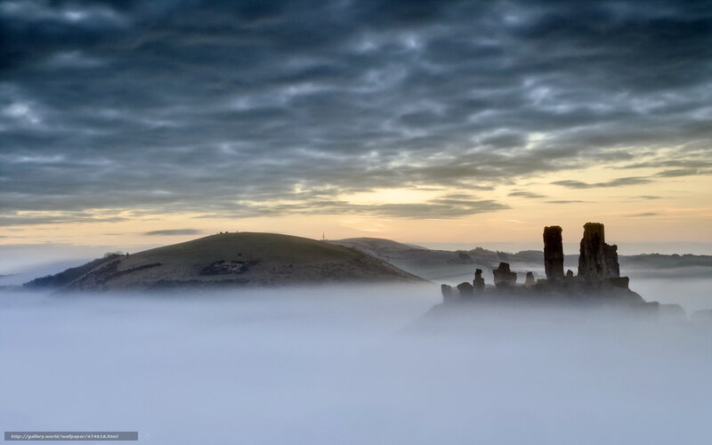 Castle ruins in morning fog