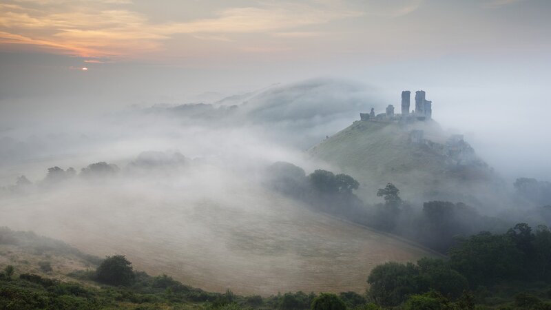 Castle ruins in morning mist