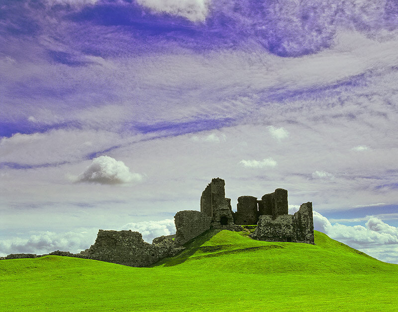 Castle ruins on a green hill