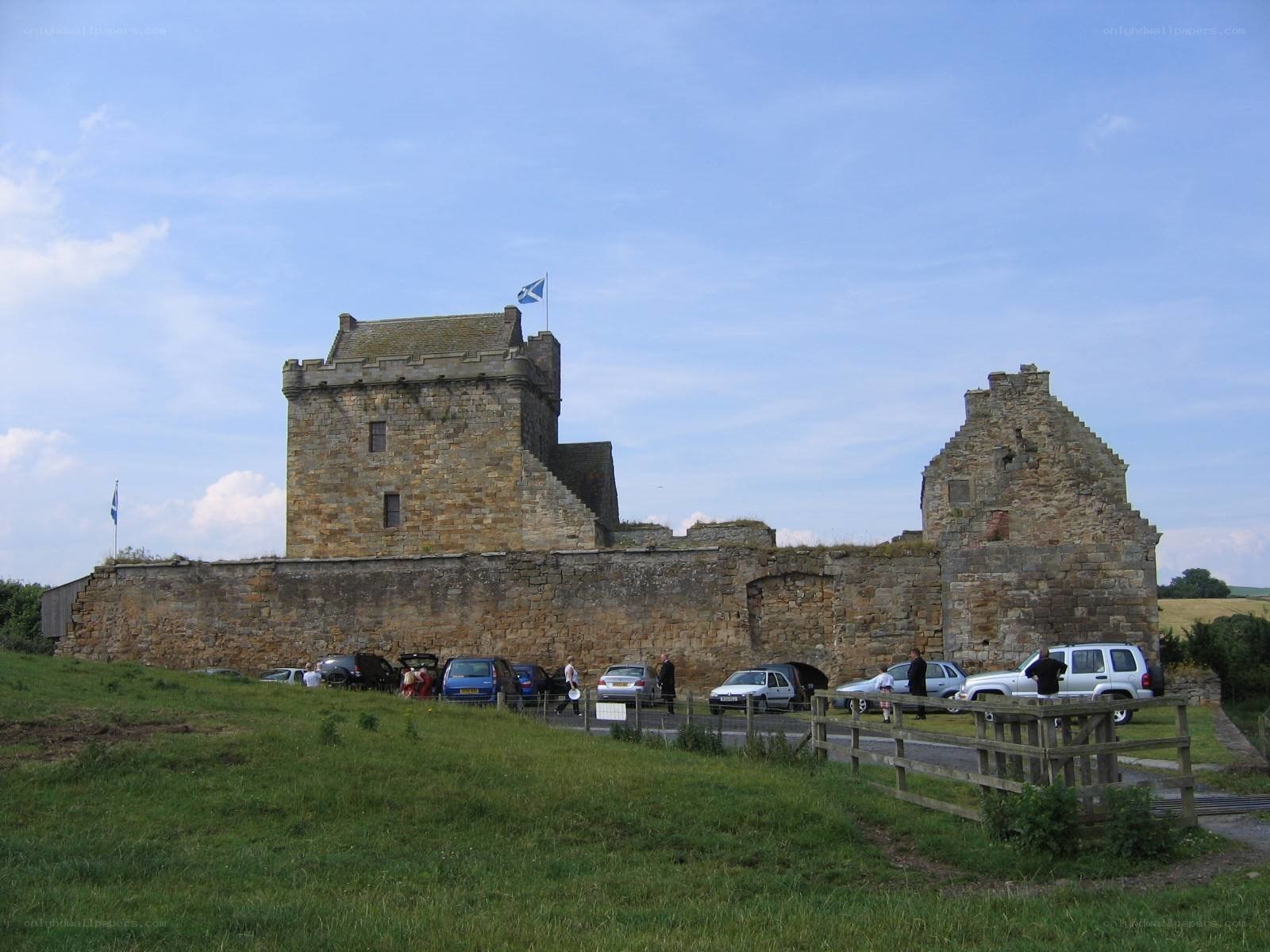 Castle ruins with Scottish flag